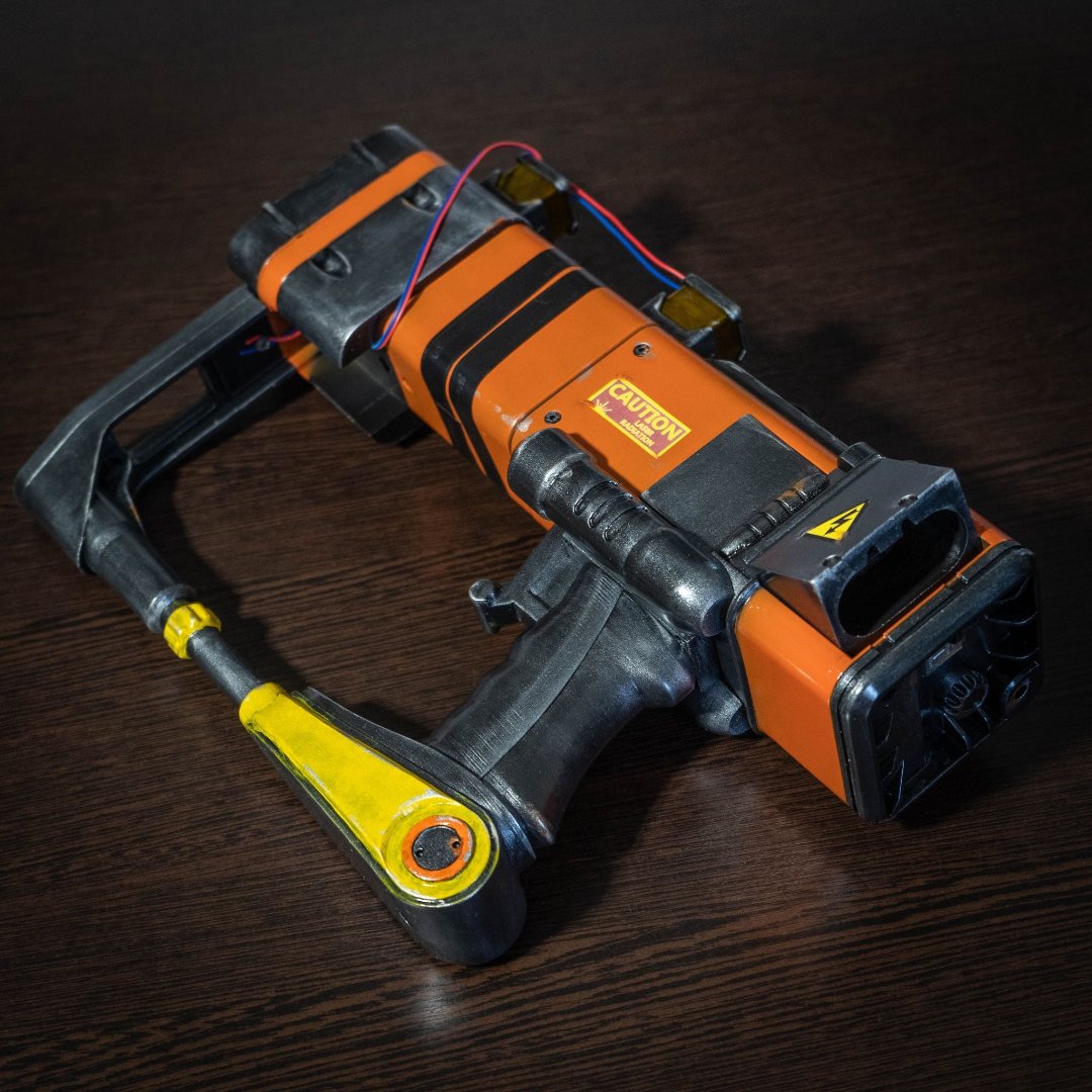 3D printed Fallout New Vegas AEP-7 laser pistol cosplay prop detailed replica with orange and black design
