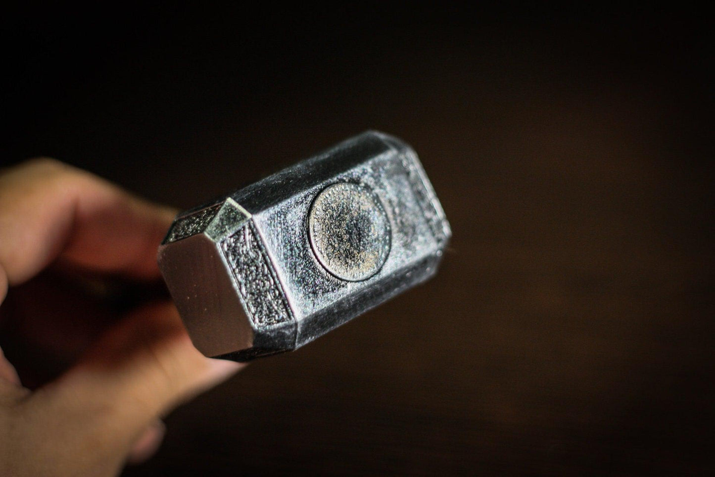 1:4 scale miniature Thor hammer replica held in hand, detailed and battle-worn finish