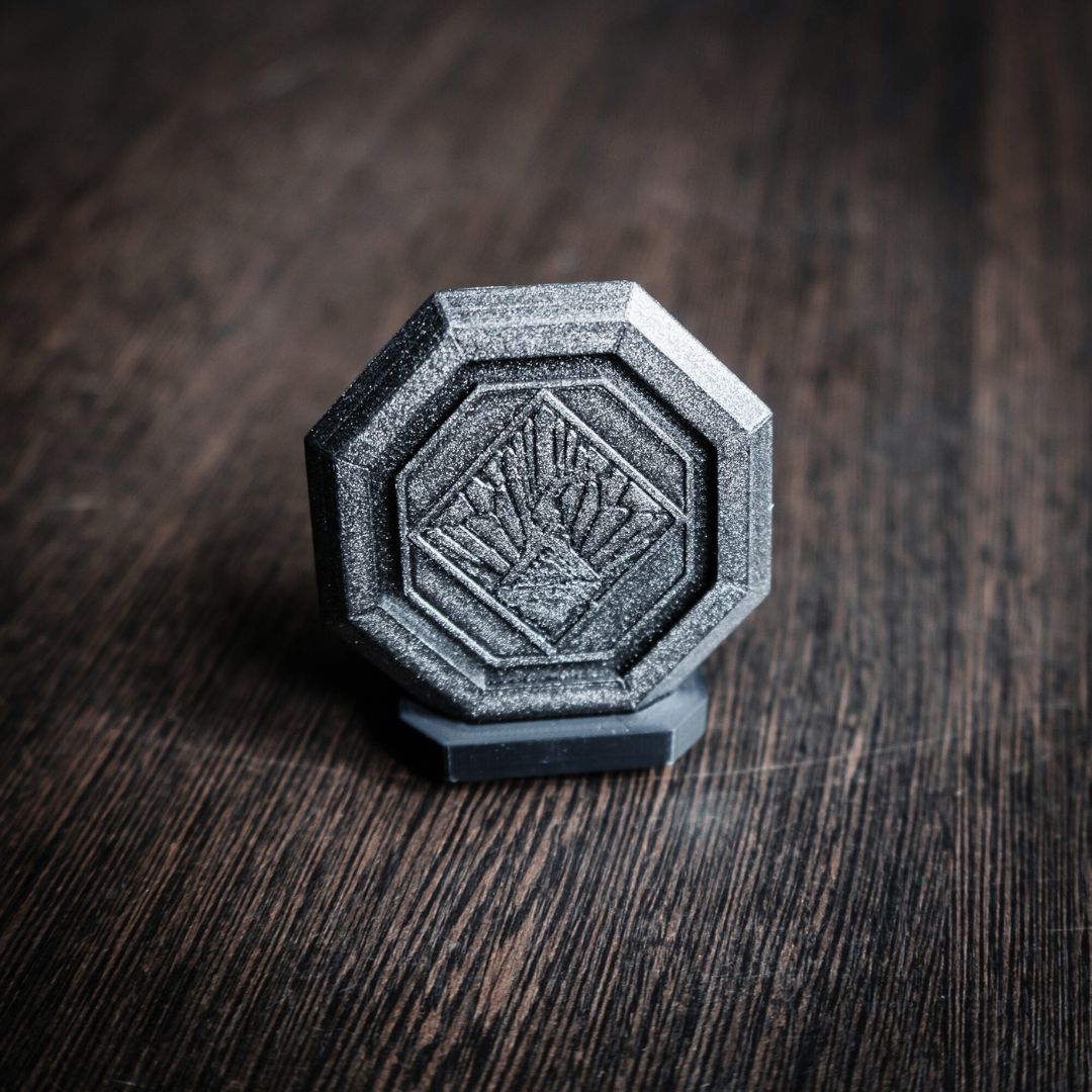 High-precision 3D printed Festival Token showing intricate quest item engravings