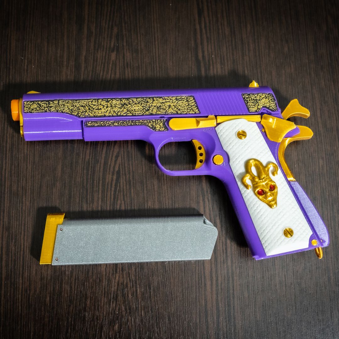Joker replica pistol with removable magazine and plastic prop bullets