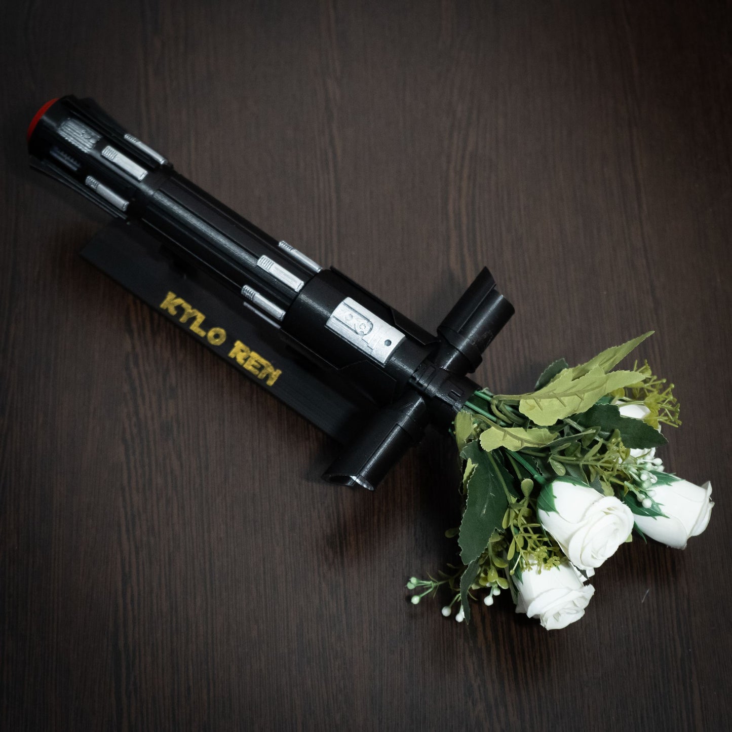 Kylo Ren lightsaber bouquet holder for a Star Wars themed wedding ceremony