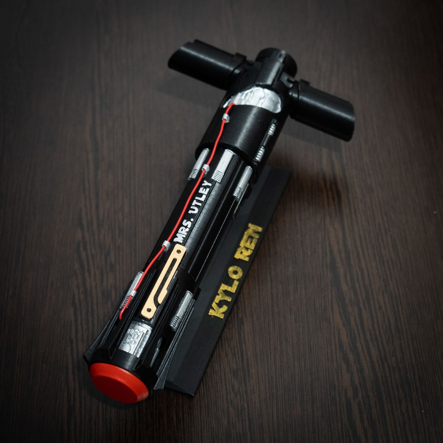 Star Wars themed wedding keepsake: Kylo Ren lightsaber on a display stand