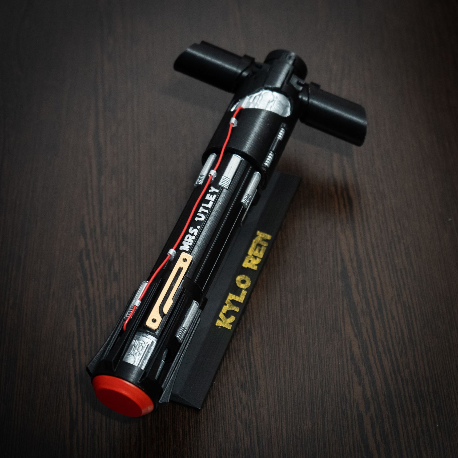 Star Wars themed wedding keepsake: Kylo Ren lightsaber on a display stand