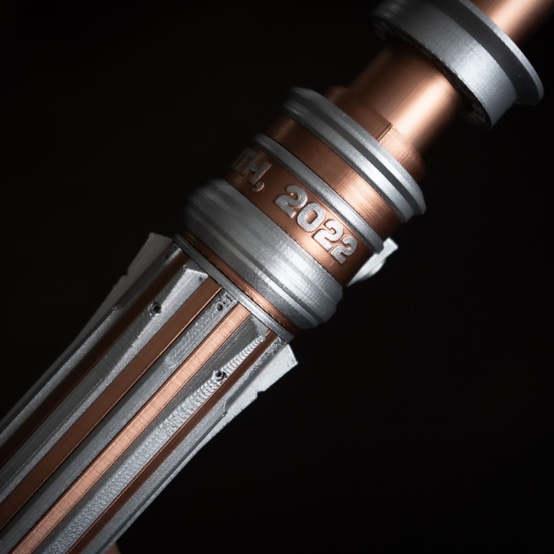 Custom engraved lightsaber bouquet handle with wedding initials and date