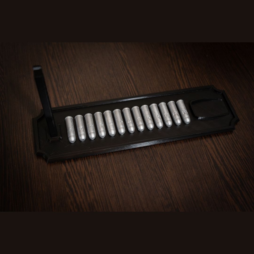 Black display stand with 13 custom replica bullets for collectors