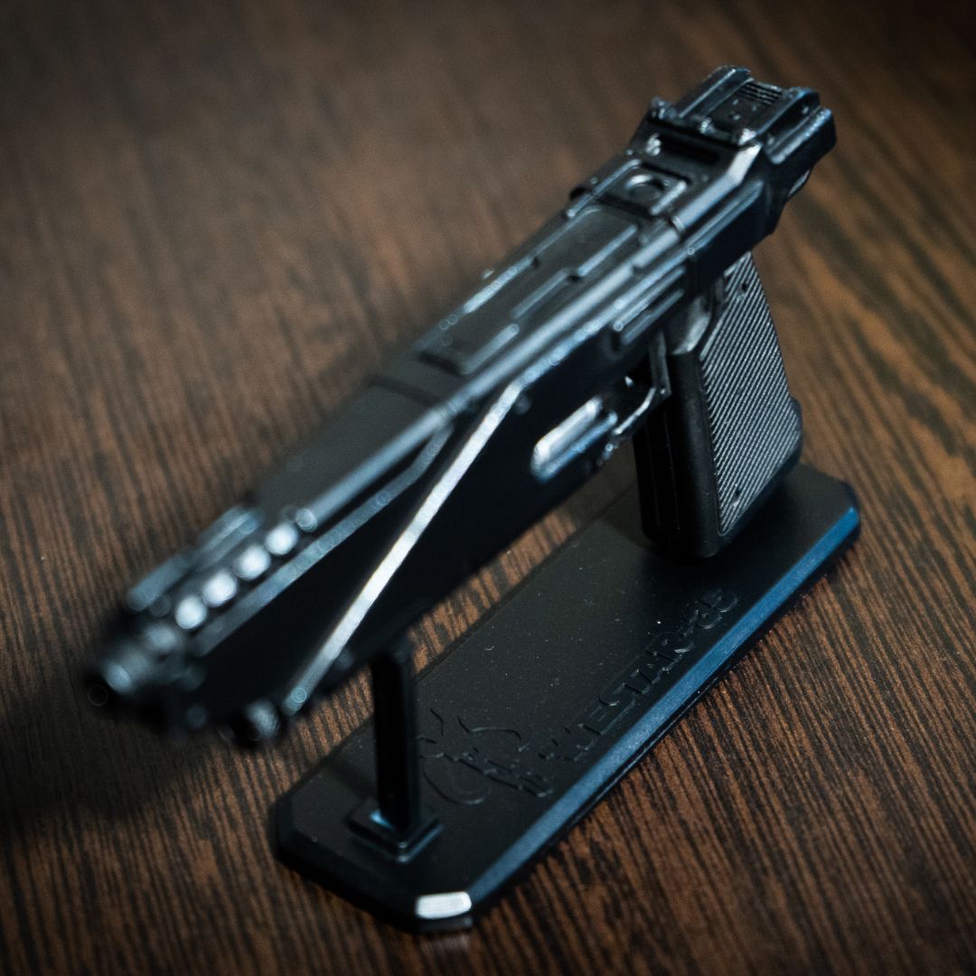 Hand-held size comparison of the 1:2 scale Westar 35 blaster miniature