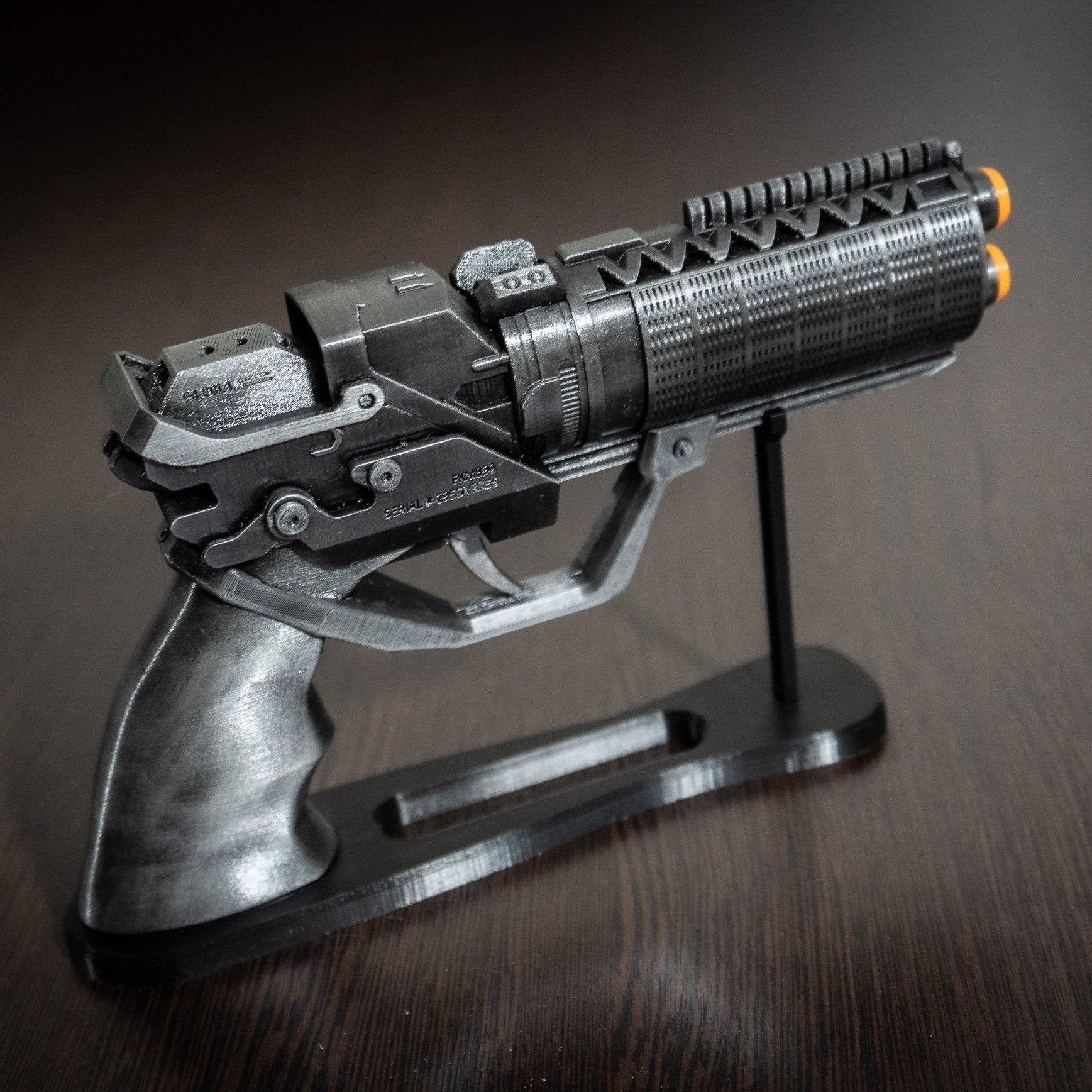 Cyberpunk themed desk decor: Blade Runner 2049 blaster and display base