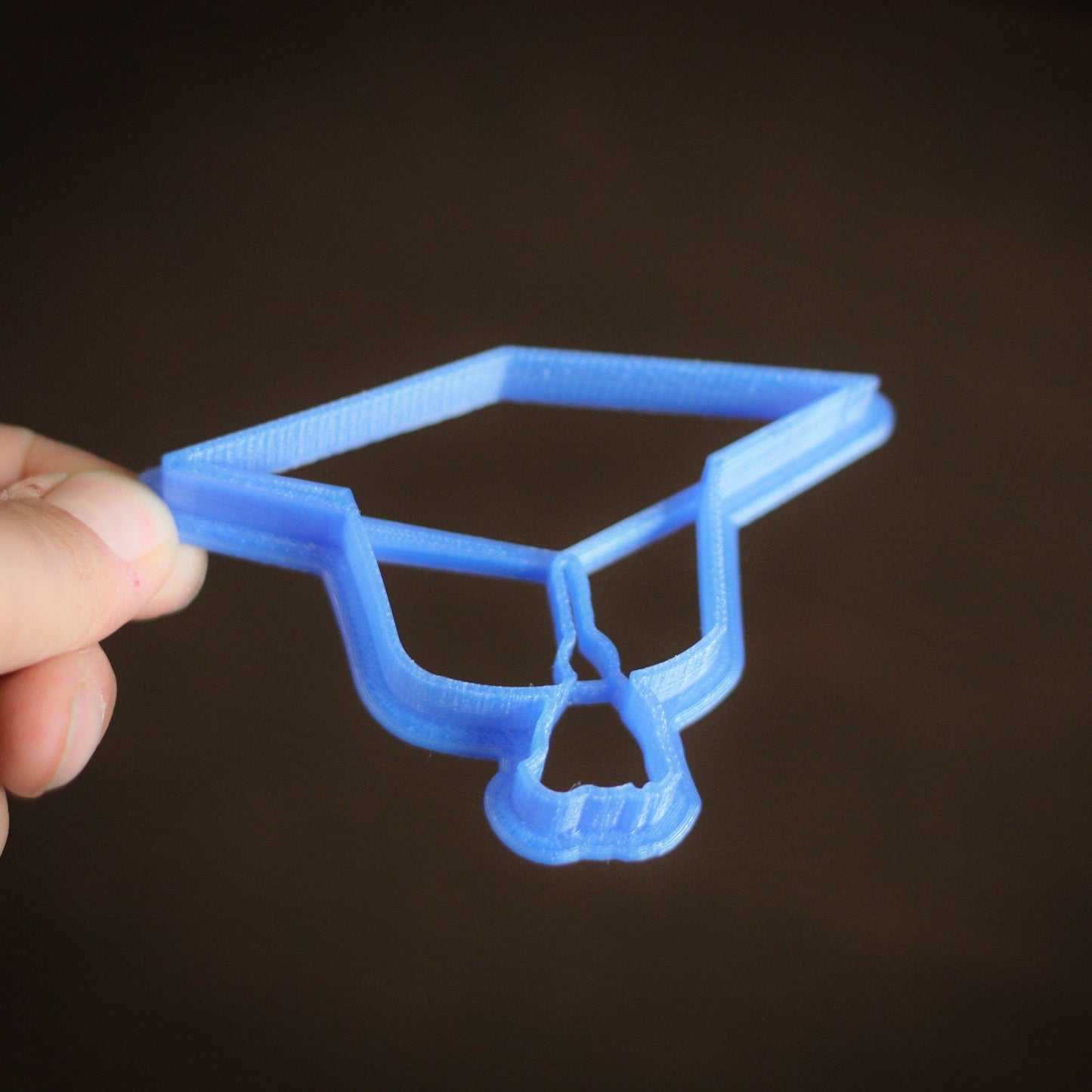 Food-safe bio-plastic graduation cookie cutter in assorted colors