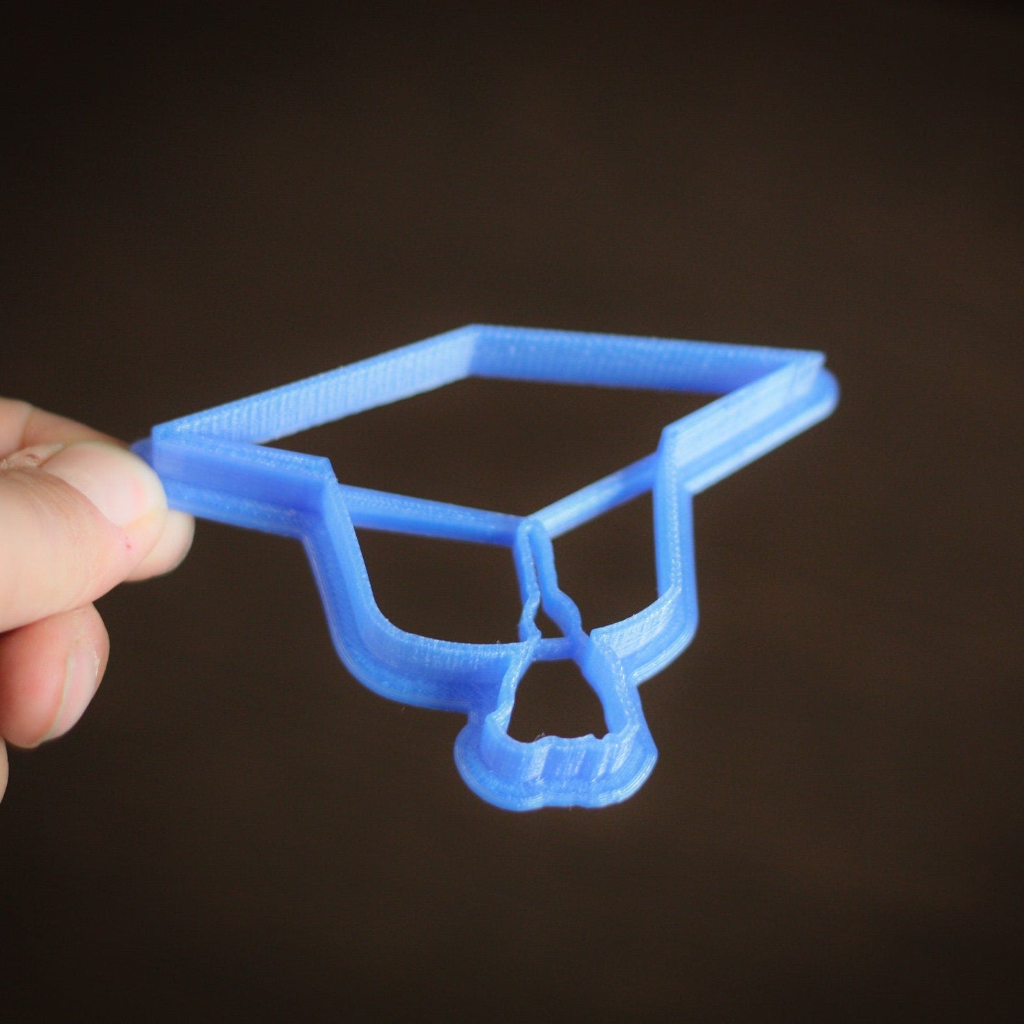 Food-safe bio-plastic graduation cookie cutter in assorted colors