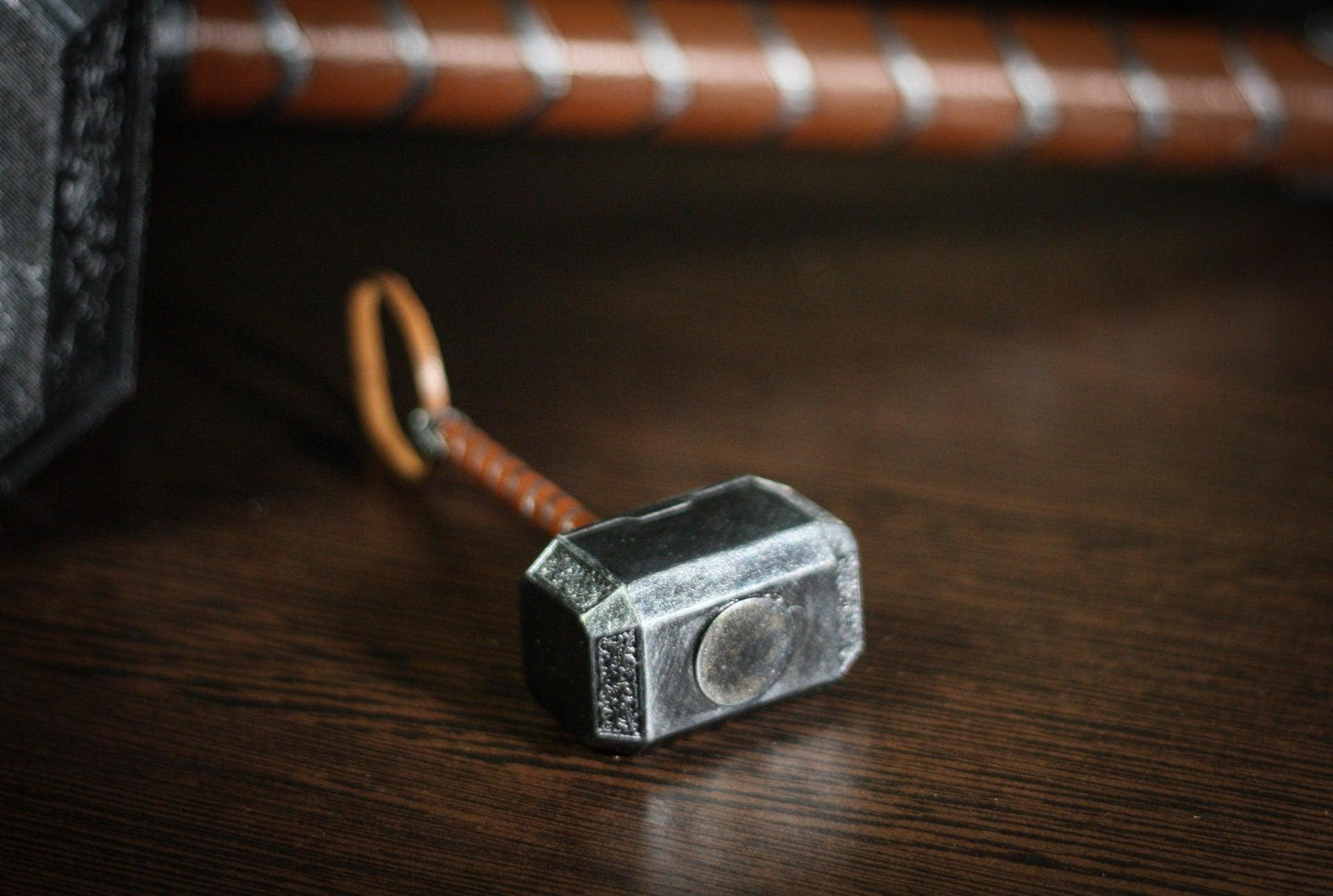 1:4 scale miniature Thor hammer replica made of hand-painted UV resin with leather-wrapped handle and display stand